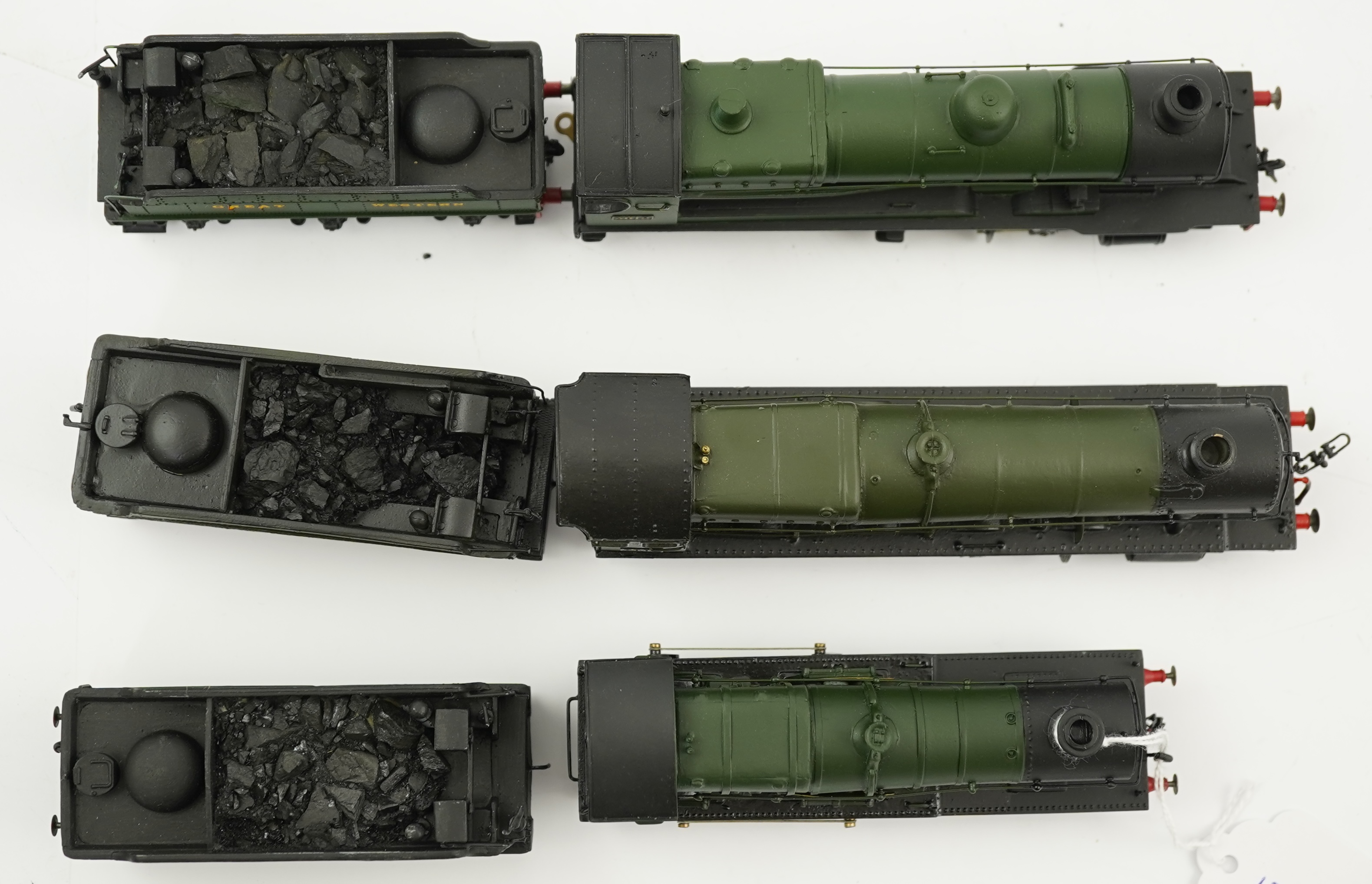Three 00 gauge brass and white metal kit built GWR tender locomotives; a 2884 class 2-8-0, 2884, together with an 33xx class 4-4-0, 3454, and a War Dept. 2-8-0, 3012, all constructed, painted and lined to a high standard